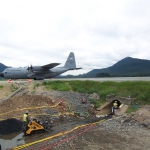 Juneau - Preparing and cleaning host pipe to receive a sliplined liner pipe in Jordan Cr under Juneau Airport.